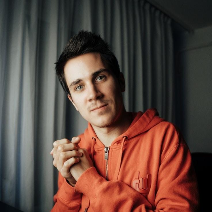 Aisha Rao, Lead Design Curator at Meander Crest Park, reviewing corporate floral arrangements